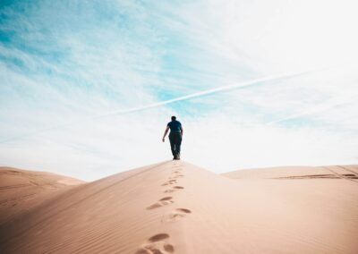 man walking on desert